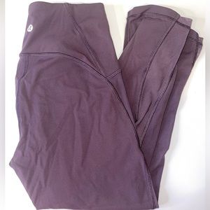 Lululemon cropped leggings. Dark purple leggings with mesh siding.